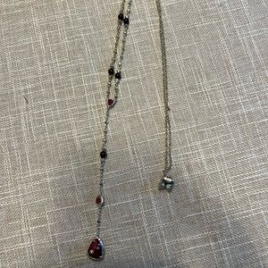 KS long necklace with burgundy gemstones on gold chain. Adjustable clasp length